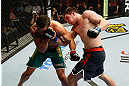 GOLD COAST, AUSTRALIA - DECEMBER 15:  (R-L) Bradley Scott punches Robert Whittaker during their welterweight fight at the UFC on FX event on December 15, 2012  at Gold Coast Convention and Exhibition Centre in Gold Coast, Australia.  (Photo by Josh Hedges/Zuffa LLC/Zuffa LLC via Getty Images)