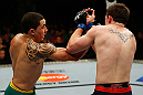 GOLD COAST, AUSTRALIA - DECEMBER 15:  (L-R) Robert Whittaker punches Bradley Scott during their welterweight fight at the UFC on FX event on December 15, 2012  at Gold Coast Convention and Exhibition Centre in Gold Coast, Australia.  (Photo by Josh Hedges/Zuffa LLC/Zuffa LLC via Getty Images)