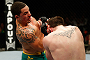 GOLD COAST, AUSTRALIA - DECEMBER 15:  (L-R) Robert Whittaker punches Bradley Scott during their welterweight fight at the UFC on FX event on December 15, 2012  at Gold Coast Convention and Exhibition Centre in Gold Coast, Australia.  (Photo by Josh Hedges/Zuffa LLC/Zuffa LLC via Getty Images)