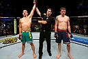 GOLD COAST, AUSTRALIA - DECEMBER 15:  Robert Whittaker (L) reacts after defeating Bradley Scott during their welterweight fight at the UFC on FX event on December 15, 2012  at Gold Coast Convention and Exhibition Centre in Gold Coast, Australia.  (Photo by Josh Hedges/Zuffa LLC/Zuffa LLC via Getty Images)