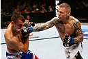 GOLD COAST, AUSTRALIA - DECEMBER 15:  (R-L) Ross Pearson punches George Sotiropoulos during their lightweight fight at the UFC on FX event on December 15, 2012  at Gold Coast Convention and Exhibition Centre in Gold Coast, Australia.  (Photo by Josh Hedges/Zuffa LLC/Zuffa LLC via Getty Images)
