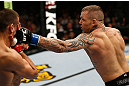 GOLD COAST, AUSTRALIA - DECEMBER 15:  (R-L) Ross Pearson punches George Sotiropoulos during their lightweight fight at the UFC on FX event on December 15, 2012  at Gold Coast Convention and Exhibition Centre in Gold Coast, Australia.  (Photo by Josh Hedges/Zuffa LLC/Zuffa LLC via Getty Images)