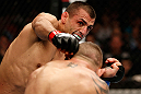 GOLD COAST, AUSTRALIA - DECEMBER 15:  (L-R) George Sotiropoulos punches Ross Pearson during their lightweight fight at the UFC on FX event on December 15, 2012  at Gold Coast Convention and Exhibition Centre in Gold Coast, Australia.  (Photo by Josh Hedges/Zuffa LLC/Zuffa LLC via Getty Images)