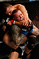 GOLD COAST, AUSTRALIA - DECEMBER 15:  (L-R) George Sotiropoulos attempts a rear choke against Ross Pearson during their lightweight fight at the UFC on FX event on December 15, 2012  at Gold Coast Convention and Exhibition Centre in Gold Coast, Australia.  (Photo by Josh Hedges/Zuffa LLC/Zuffa LLC via Getty Images)