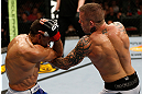 GOLD COAST, AUSTRALIA - DECEMBER 15:  (R-L) Ross Pearson punches George Sotiropoulos during their lightweight fight at the UFC on FX event on December 15, 2012  at Gold Coast Convention and Exhibition Centre in Gold Coast, Australia.  (Photo by Josh Hedges/Zuffa LLC/Zuffa LLC via Getty Images)