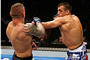 GOLD COAST, AUSTRALIA - DECEMBER 15:  (R-L) George Sotiropoulos punches Ross Pearson during their lightweight fight at the UFC on FX event on December 15, 2012  at Gold Coast Convention and Exhibition Centre in Gold Coast, Australia.  (Photo by Josh Hedges/Zuffa LLC/Zuffa LLC via Getty Images)