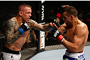 GOLD COAST, AUSTRALIA - DECEMBER 15:  (L-R) Ross Pearson punches George Sotiropoulos during their lightweight fight at the UFC on FX event on December 15, 2012  at Gold Coast Convention and Exhibition Centre in Gold Coast, Australia.  (Photo by Josh Hedges/Zuffa LLC/Zuffa LLC via Getty Images)