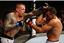 GOLD COAST, AUSTRALIA - DECEMBER 15:  (L-R) Ross Pearson punches George Sotiropoulos during their lightweight fight at the UFC on FX event on December 15, 2012  at Gold Coast Convention and Exhibition Centre in Gold Coast, Australia.  (Photo by Josh Hedges/Zuffa LLC/Zuffa LLC via Getty Images)