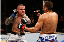 GOLD COAST, AUSTRALIA - DECEMBER 15:  (L-R) Ross Pearson punches George Sotiropoulos during their lightweight fight at the UFC on FX event on December 15, 2012  at Gold Coast Convention and Exhibition Centre in Gold Coast, Australia.  (Photo by Josh Hedges/Zuffa LLC/Zuffa LLC via Getty Images)
