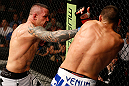 GOLD COAST, AUSTRALIA - DECEMBER 15:  (L-R) Ross Pearson punches George Sotiropoulos during their lightweight fight at the UFC on FX event on December 15, 2012  at Gold Coast Convention and Exhibition Centre in Gold Coast, Australia.  (Photo by Josh Hedges/Zuffa LLC/Zuffa LLC via Getty Images)