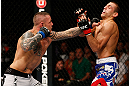 GOLD COAST, AUSTRALIA - DECEMBER 15:  (L-R) Ross Pearson punches George Sotiropoulos during their lightweight fight at the UFC on FX event on December 15, 2012  at Gold Coast Convention and Exhibition Centre in Gold Coast, Australia.  (Photo by Josh Hedges/Zuffa LLC/Zuffa LLC via Getty Images)