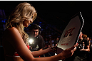 GOLD COAST, AUSTRALIA - DECEMBER 15:  UFC Octagon Girl Kristie McKeon introduces a round during the UFC on FX event on December 15, 2012  at Gold Coast Convention and Exhibition Centre in Gold Coast, Australia.  (Photo by Josh Hedges/Zuffa LLC/Zuffa LLC via Getty Images)