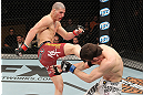 LAS VEGAS, NV - DECEMBER 15:  (L-R) Jared Papazian kicks Timothy Elliott during their flyweight fight at the TUF 16 Finale on December 15, 2012  at the Joint at the Hard Rock in Las Vegas, Nevada.  (Photo by Jim Kemper/Zuffa LLC/Zuffa LLC via Getty Images) *** Local Caption ***Jared Papazian; Timothy Elliott
