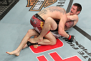 LAS VEGAS, NV - DECEMBER 15:  (R-L) Timothy Elliott attempts to submit Jared Papzian during their flyweight fight at the TUF 16 Finale on December 15, 2012  at the Joint at the Hard Rock in Las Vegas, Nevada.  (Photo by Jim Kemper/Zuffa LLC/Zuffa LLC via Getty Images) *** Local Caption ***Jared Papazian; Timothy Elliott