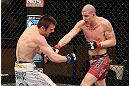 LAS VEGAS, NV - DECEMBER 15:  (R-L) Jared Papazian punches Timothy Elliott during their flyweight fight at the TUF 16 Finale on December 15, 2012  at the Joint at the Hard Rock in Las Vegas, Nevada.  (Photo by Jim Kemper/Zuffa LLC/Zuffa LLC via Getty Images) *** Local Caption ***Jared Papazian; Timothy Elliott