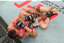 LAS VEGAS, NV - DECEMBER 15:  (L-R) Timothy Elliott attempts to submit Jared Papazian during their flyweight fight at the TUF 16 Finale on December 15, 2012  at the Joint at the Hard Rock in Las Vegas, Nevada.  (Photo by Jim Kemper/Zuffa LLC/Zuffa LLC via Getty Images) *** Local Caption ***Jared Papazian; Timothy Elliott