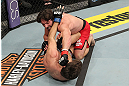 LAS VEGAS, NV - DECEMBER 15:  Mike Rio (top) punches John Cofer (bottom) during their lightweight fight at the TUF 16 Finale on December 15, 2012  at the Joint at the Hard Rock in Las Vegas, Nevada.  (Photo by Jim Kemper/Zuffa LLC/Zuffa LLC via Getty Images) *** Local Caption *** Mike Rio; John Cofer