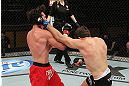 LAS VEGAS, NV - DECEMBER 15:  (R-L) John Cofer punches Mike Rio during their lightweight fight at the TUF 16 Finale on December 15, 2012  at the Joint at the Hard Rock in Las Vegas, Nevada.  (Photo by Jim Kemper/Zuffa LLC/Zuffa LLC via Getty Images) *** Local Caption *** Mike Rio; John Cofer