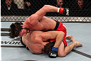 LAS VEGAS, NV - DECEMBER 15:  Mike Rio (top) punches John Cofer during their lightweight fight at the TUF 16 Finale on December 15, 2012  at the Joint at the Hard Rock in Las Vegas, Nevada.  (Photo by Jim Kemper/Zuffa LLC/Zuffa LLC via Getty Images) *** Local Caption *** Mike Rio; John Cofer