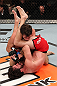 LAS VEGAS, NV - DECEMBER 15:  Mike Rio (red shorts) attempts to submit John Cofer during their lightweight fight at the TUF 16 Finale on December 15, 2012  at the Joint at the Hard Rock in Las Vegas, Nevada.  (Photo by Jim Kemper/Zuffa LLC/Zuffa LLC via Getty Images) *** Local Caption *** Mike Rio; John Cofer