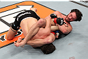LAS VEGAS, NV - DECEMBER 15:  Mike Rio (right) attempts to submit John Cofer during their lightweight fight at the TUF 16 Finale on December 15, 2012  at the Joint at the Hard Rock in Las Vegas, Nevada.  (Photo by Jim Kemper/Zuffa LLC/Zuffa LLC via Getty Images) *** Local Caption *** Mike Rio; John Cofer