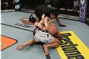 LAS VEGAS, NV - DECEMBER 15:  T.J. Walkdburger attempts to submit Nick Catone (white shorts) while referee Herb Dean looks on during their welterweight fight at the TUF 16 Finale on December 15, 2012  at the Joint at the Hard Rock in Las Vegas, Nevada.  (Photo by Jim Kemper/Zuffa LLC/Zuffa LLC via Getty Images) *** Local Caption *** T.J. Waldburger; Nick Catone; Herb Dean