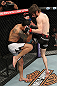 LAS VEGAS, NV - DECEMBER 15:  (R-L) Johnny Bedford knees Marcos Vinicius during their bantamweight fight at the TUF 16 Finale on December 15, 2012  at the Joint at the Hard Rock in Las Vegas, Nevada.  (Photo by Jim Kemper/Zuffa LLC/Zuffa LLC via Getty Images) *** Local Caption *** Johny Bedford; Marcos Vinicius