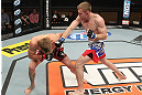 LAS VEGAS, NV - DECEMBER 15:  (R-L) James Head punches Mike Pyle during their welterweight fight at the TUF 16 Finale on December 15, 2012  at the Joint at the Hard Rock in Las Vegas, Nevada.  (Photo by Jim Kemper/Zuffa LLC/Zuffa LLC via Getty Images) *** Local Caption *** Mike Pyle; James Head