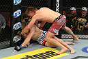 LAS VEGAS, NV - DECEMBER 15:  (R-L) Mike Pyle punches James Head during their welterweight fight at the TUF 16 Finale on December 15, 2012  at the Joint at the Hard Rock in Las Vegas, Nevada.  (Photo by Jim Kemper/Zuffa LLC/Zuffa LLC via Getty Images) *** Local Caption *** Mike Pyle; James Head
