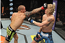 LAS VEGAS, NV - DECEMBER 15:  (L-R) Dustin Poirier punches Jonathan Brookins during their featherweight fight at the TUF 16 Finale on December 15, 2012  at the Joint at the Hard Rock in Las Vegas, Nevada.  (Photo by Jim Kemper/Zuffa LLC/Zuffa LLC via Getty Images) *** Local Caption *** Dustn Poirier; Jonathan Brookins
