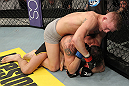 LAS VEGAS, NV - DECEMBER 15:  Colton Smith (top) punches Mike Ricci during their lightweight fight at the TUF 16 Finale on December 15, 2012  at the Joint at the Hard Rock in Las Vegas, Nevada.  (Photo by Jim Kemper/Zuffa LLC/Zuffa LLC via Getty Images) *** Local Caption *** Colton Smith; Mike Ricci