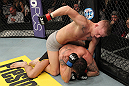 LAS VEGAS, NV - DECEMBER 15:  Colton Smith (top) punches Mike Ricci during their lightweight fight at the TUF 16 Finale on December 15, 2012  at the Joint at the Hard Rock in Las Vegas, Nevada.  (Photo by Jim Kemper/Zuffa LLC/Zuffa LLC via Getty Images) *** Local Caption *** Colton Smith; Mike Ricci
