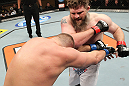 LAS VEGAS, NV - DECEMBER 15:  (R-L) Roy Nelson punches Matt Mitrione during their heavyweight fight at the TUF 16 Finale on December 15, 2012  at the Joint at the Hard Rock in Las Vegas, Nevada.  (Photo by Jim Kemper/Zuffa LLC/Zuffa LLC via Getty Images) *** Local Caption *** Roy Nelson; Matt Mitrione