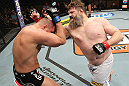 LAS VEGAS, NV - DECEMBER 15:  (R-L) Roy Nelson punches Matt Mitrione during their heavyweight fight at the TUF 16 Finale on December 15, 2012  at the Joint at the Hard Rock in Las Vegas, Nevada.  (Photo by Jim Kemper/Zuffa LLC/Zuffa LLC via Getty Images) *** Local Caption *** Roy Nelson; Matt Mitrione