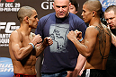 LAS VEGAS, NV - DECEMBER 28:  (L-R) Opponents Chris Cariaso and John Moraga face off during the UFC 155 weigh-in on December 28, 2012 at MGM Grand Garden Arena in Las Vegas, Nevada. (Photo by Josh Hedges/Zuffa LLC/Zuffa LLC via Getty Images)