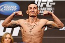 LAS VEGAS, NV - DECEMBER 28:  Max Holloway flexes during the UFC 155 weigh-in on December 28, 2012 at MGM Grand Garden Arena in Las Vegas, Nevada. (Photo by Josh Hedges/Zuffa LLC/Zuffa LLC via Getty Images)