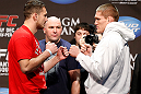 LAS VEGAS, NV - DECEMBER 28:  (L-R) Opponents Phil De Fries and Todd Duffee face off during the UFC 155 weigh-in on December 28, 2012 at MGM Grand Garden Arena in Las Vegas, Nevada. (Photo by Josh Hedges/Zuffa LLC/Zuffa LLC via Getty Images)