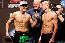 LAS VEGAS, NV - DECEMBER 28:  (L-R) Opponents Erik Perez and Byron Bloodworth face off during the UFC 155 weigh-in on December 28, 2012 at MGM Grand Garden Arena in Las Vegas, Nevada. (Photo by Josh Hedges/Zuffa LLC/Zuffa LLC via Getty Images)