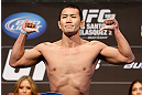 LAS VEGAS, NV - DECEMBER 28:  Yushin Okami flexes during the UFC 155 weigh-in on December 28, 2012 at MGM Grand Garden Arena in Las Vegas, Nevada. (Photo by Josh Hedges/Zuffa LLC/Zuffa LLC via Getty Images)