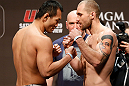 LAS VEGAS, NV - DECEMBER 28:  (L-R) Opponents Yushin Okami and Alan Belcher face off during the UFC 155 weigh-in on December 28, 2012 at MGM Grand Garden Arena in Las Vegas, Nevada. (Photo by Josh Hedges/Zuffa LLC/Zuffa LLC via Getty Images)
