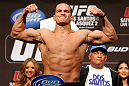 LAS VEGAS, NV - DECEMBER 28:  UFC Heavyweight Champion Junior dos Santos flexes during the UFC 155 weigh-in on December 28, 2012 at MGM Grand Garden Arena in Las Vegas, Nevada. (Photo by Josh Hedges/Zuffa LLC/Zuffa LLC via Getty Images)
