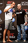 LAS VEGAS, NV - DECEMBER 28:  (L-R) UFC Heavyweight Champion Junior dos Santos is interviewed by Joe Rogan during the UFC 155 weigh-in on December 28, 2012 at MGM Grand Garden Arena in Las Vegas, Nevada. (Photo by Josh Hedges/Zuffa LLC/Zuffa LLC via Getty Images)