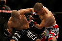 LAS VEGAS, NV - DECEMBER 29:  (L-R) John Moraga punches Chris Cariaso during their flyweight fight at UFC 155 on December 29, 2012 at MGM Grand Garden Arena in Las Vegas, Nevada. (Photo by Josh Hedges/Zuffa LLC/Zuffa LLC via Getty Images) *** Local Caption *** Chris Cariaso; John Moraga