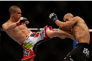 LAS VEGAS, NV - DECEMBER 29:  (L-R) Chris Cariaso kicks John Moraga during their flyweight fight at UFC 155 on December 29, 2012 at MGM Grand Garden Arena in Las Vegas, Nevada. (Photo by Josh Hedges/Zuffa LLC/Zuffa LLC via Getty Images) *** Local Caption *** Chris Cariaso; John Moraga