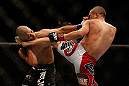 LAS VEGAS, NV - DECEMBER 29:  (R-L) Chris Cariaso kicks John Moraga during their flyweight fight at UFC 155 on December 29, 2012 at MGM Grand Garden Arena in Las Vegas, Nevada. (Photo by Josh Hedges/Zuffa LLC/Zuffa LLC via Getty Images) *** Local Caption *** Chris Cariaso; John Moraga