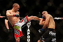 LAS VEGAS, NV - DECEMBER 29:  (L-R) Chris Cariaso kicks John Moraga during their flyweight fight at UFC 155 on December 29, 2012 at MGM Grand Garden Arena in Las Vegas, Nevada. (Photo by Josh Hedges/Zuffa LLC/Zuffa LLC via Getty Images) *** Local Caption *** Chris Cariaso; John Moraga