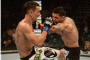 LAS VEGAS, NV - DECEMBER 29:  (L-R) Leonard Garcia punches Max Holloway during their featherweight fight at UFC 155 on December 29, 2012 at MGM Grand Garden Arena in Las Vegas, Nevada. (Photo by Donald Miralle/Zuffa LLC/Zuffa LLC via Getty Images) *** Local Caption *** Leonard Garcia; Max Holloway