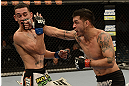 LAS VEGAS, NV - DECEMBER 29:  (R-L) Leonard Garcia punches Max Holloway during their featherweight fight at UFC 155 on December 29, 2012 at MGM Grand Garden Arena in Las Vegas, Nevada. (Photo by Donald Miralle/Zuffa LLC/Zuffa LLC via Getty Images) *** Local Caption *** Leonard Garcia; Max Holloway