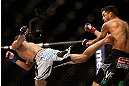 LAS VEGAS, NV - DECEMBER 29:  (L-R) Max Holloway kicks Leonard Garcia during their featherweight fight at UFC 155 on December 29, 2012 at MGM Grand Garden Arena in Las Vegas, Nevada. (Photo by Josh Hedges/Zuffa LLC/Zuffa LLC via Getty Images) *** Local Caption *** Leonard Garcia; Max Holloway