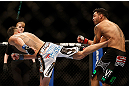 LAS VEGAS, NV - DECEMBER 29:  (L-R) Max Holloway kicks Leonard Garcia during their featherweight fight at UFC 155 on December 29, 2012 at MGM Grand Garden Arena in Las Vegas, Nevada. (Photo by Josh Hedges/Zuffa LLC/Zuffa LLC via Getty Images) *** Local Caption *** Leonard Garcia; Max Holloway